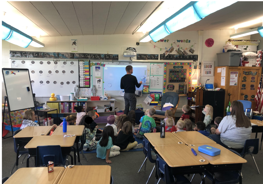Mr. Wester teaching a real life application to math in Mrs. Calonder's first grade classroom. 
