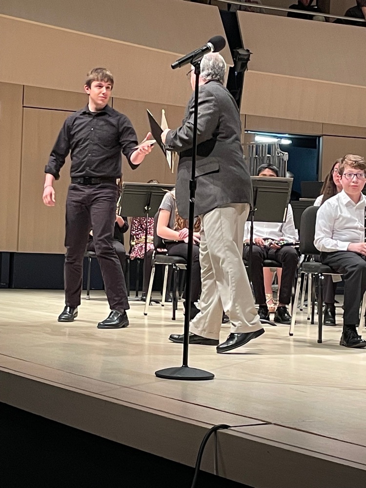 Noah accepting music for the all state 8th grade band  
