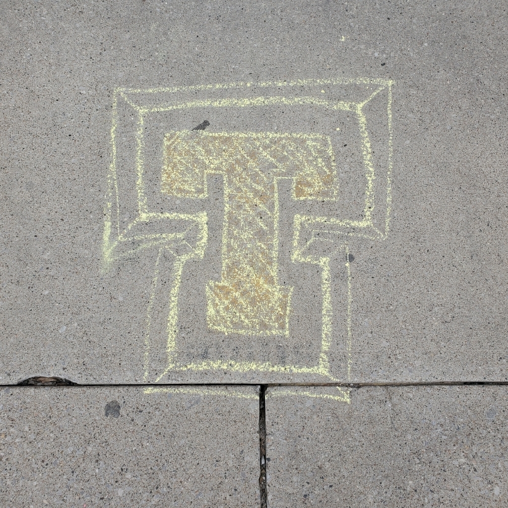 tipton T on sidewalk