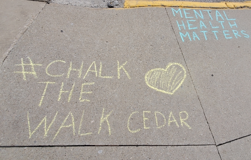 MH matters on sidewalk